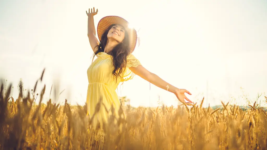 a woman in a field of wheat