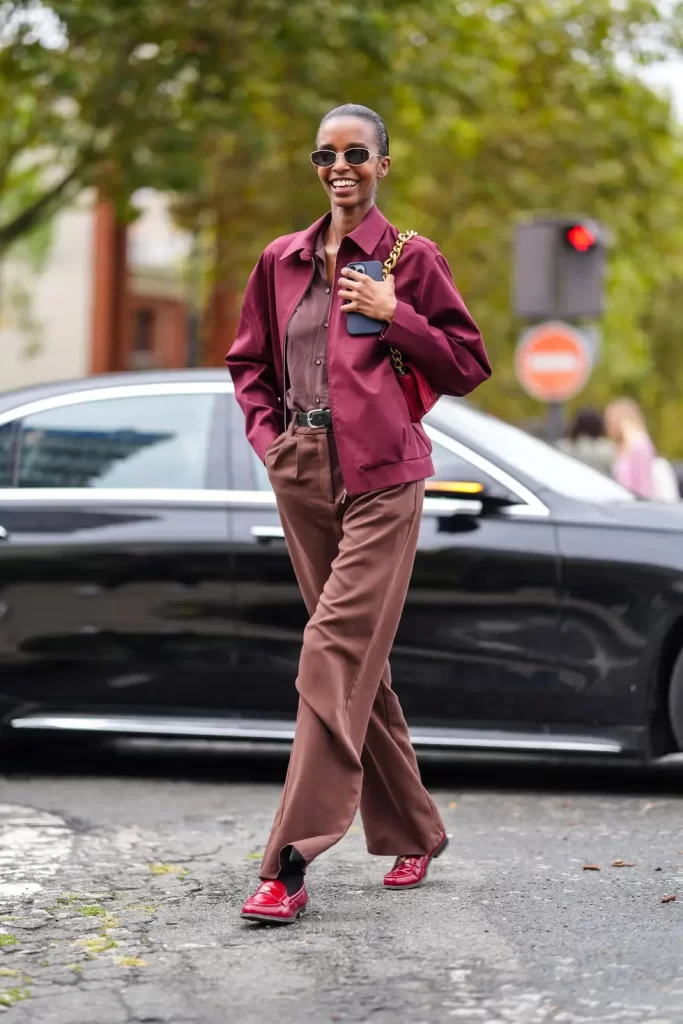 model wears black sunglasses dark red oversized jacket dark news photo 1730130386